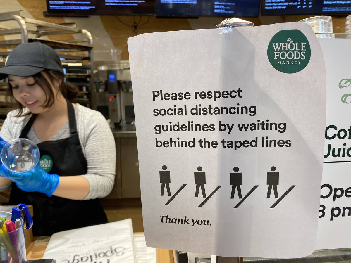 Social distancing information at Whole Foods at 8855 W. Charleston Blvd. in Las Vegas Tuesday, ...