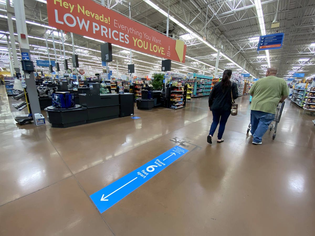 Social distancing markings on the floor at Walmart Supercenter at 3950 W. Lake Mead Blvd. in No ...