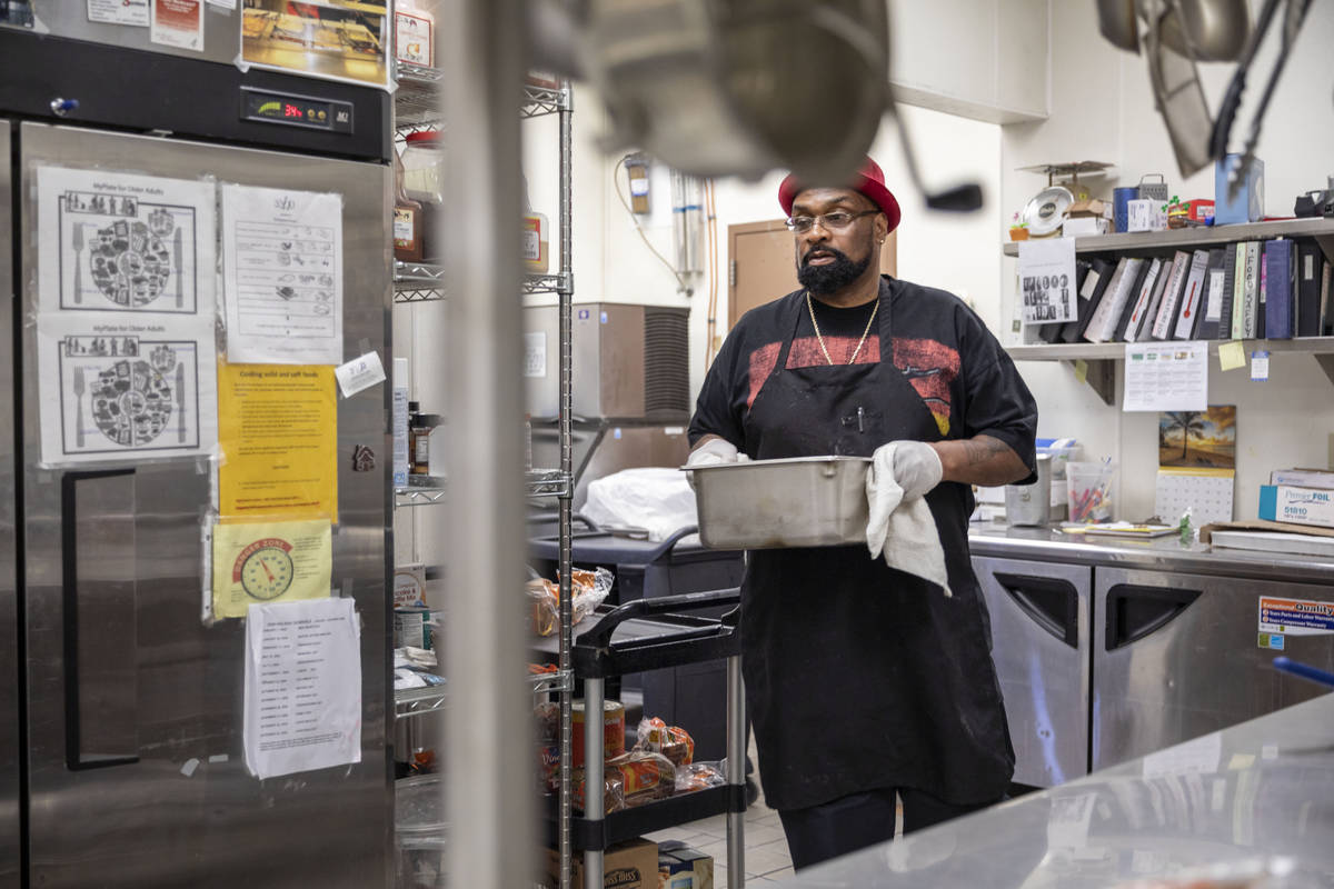 Chef Lester Johnson prepares meals at Martin Luther King Jr. Senior Center that is closed down ...