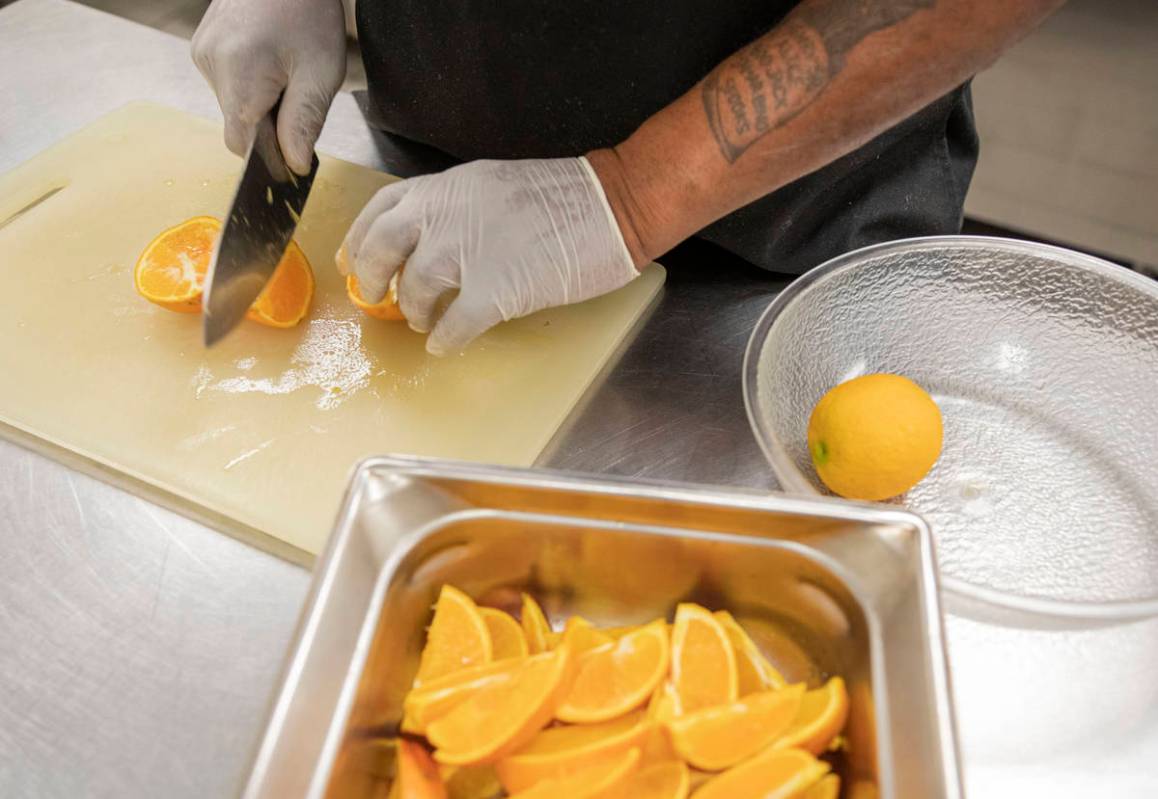 Chef Lester Johnson prepares meals at Martin Luther King Jr. Senior Center that is closed down ...