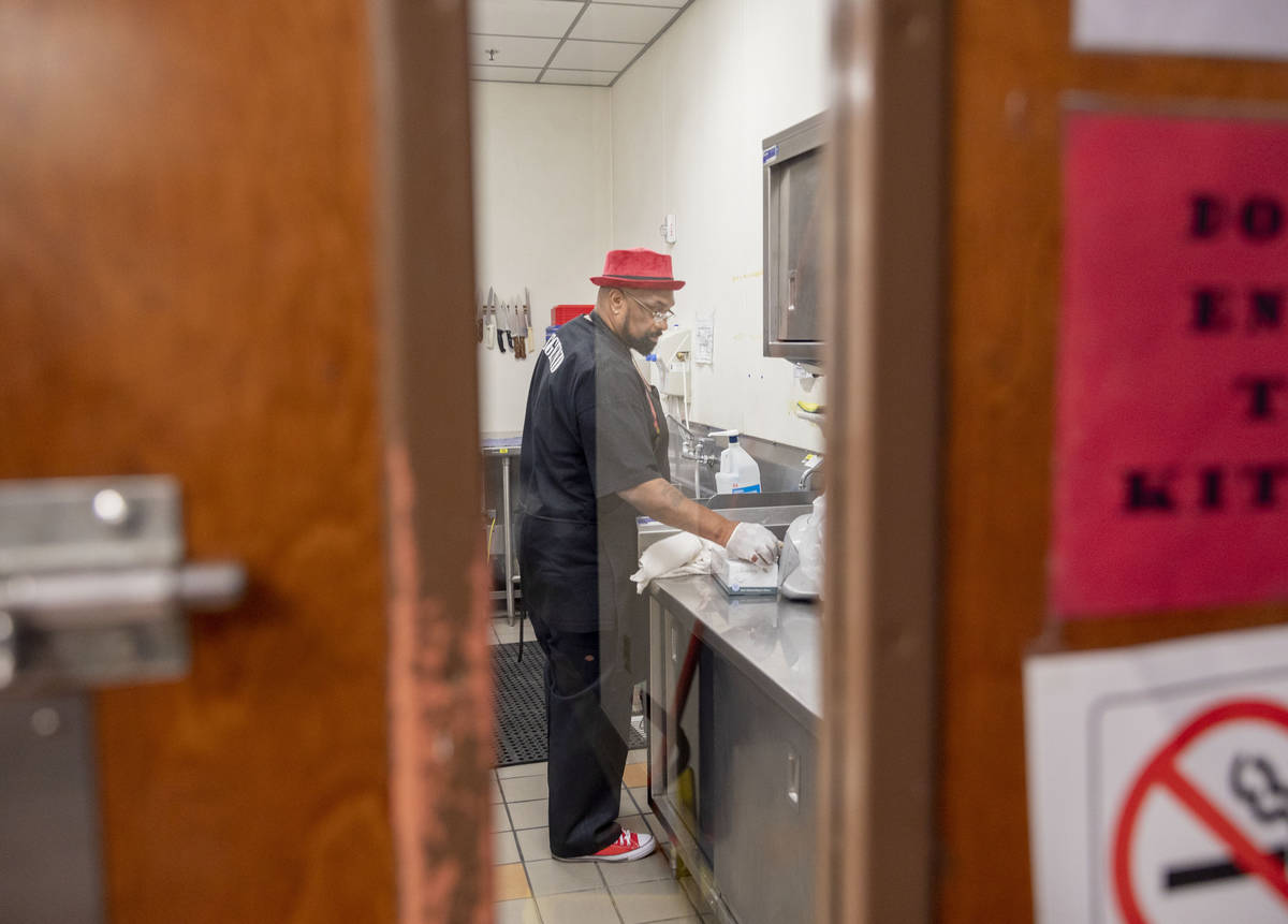 Chef Lester Johnson prepares meals at Martin Luther King Jr. Senior Center that is closed down ...