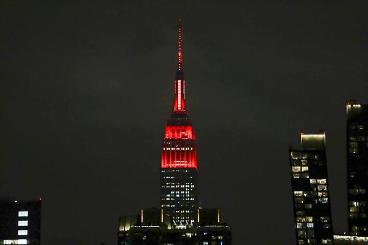 The Empire State building is lit in red and white lights to honor emergency medical workers Tue ...