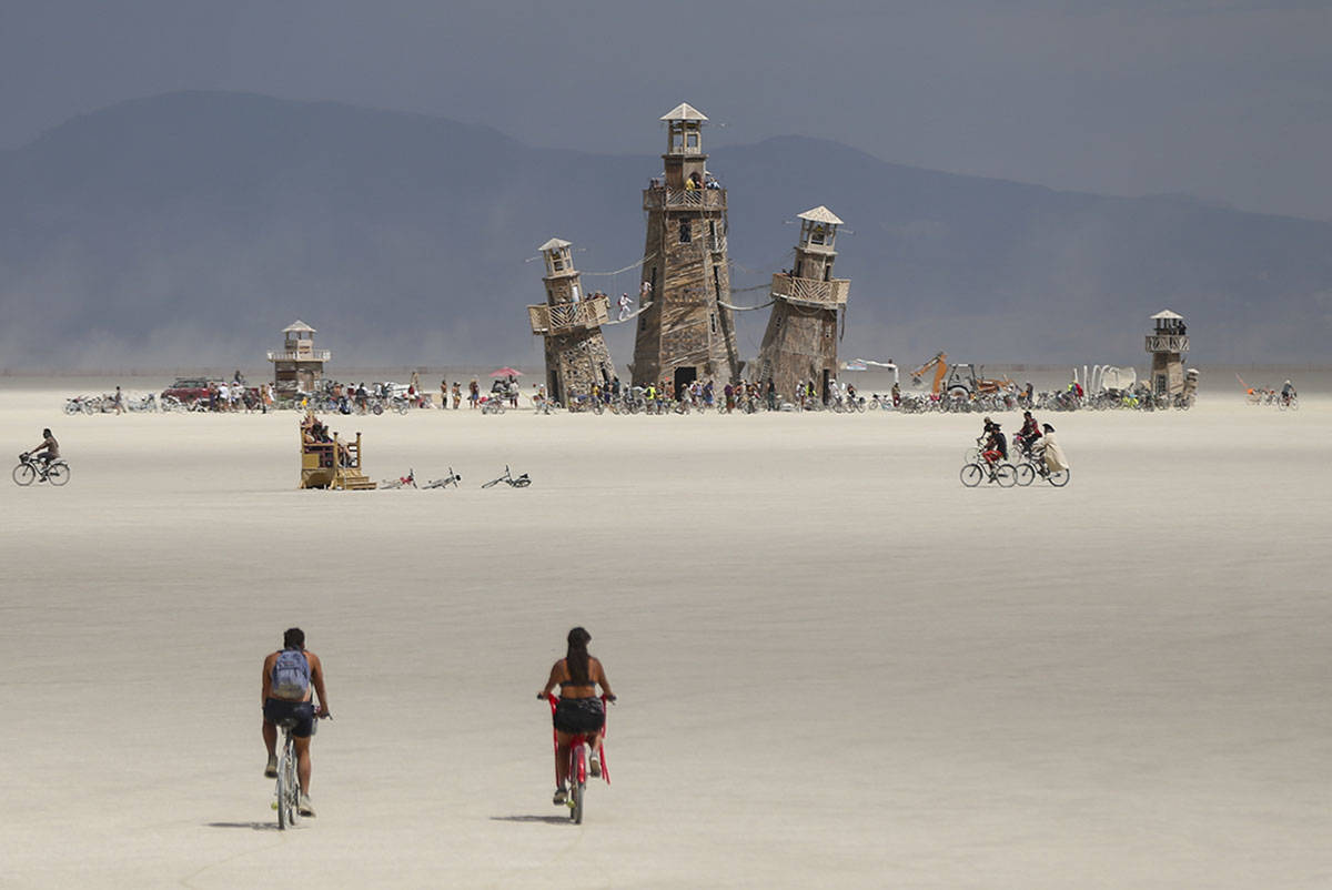 The Black Rock Lighthouse Service installation is shown in the distance during Burning Man at t ...