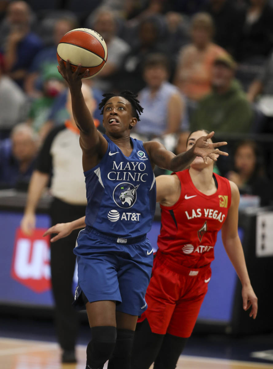Minnesota Lynx guard Danielle Robinson (3) puts up a first half shot up after driving past Las ...