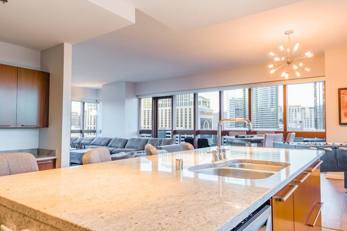 The kitchen showcases professional-grade stainless steel appliances. (Red Luxury Real Estate)