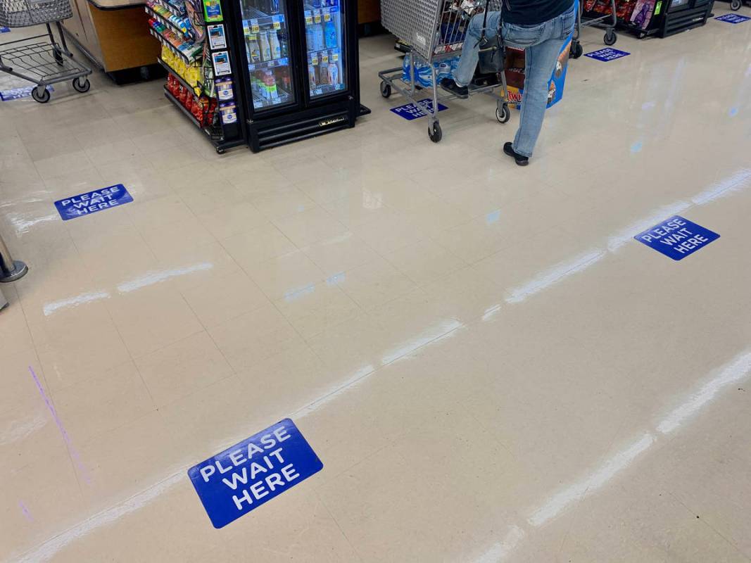 Feet placemats are seen to help social distancing at the Smith's store on E Sunset Road in Hend ...