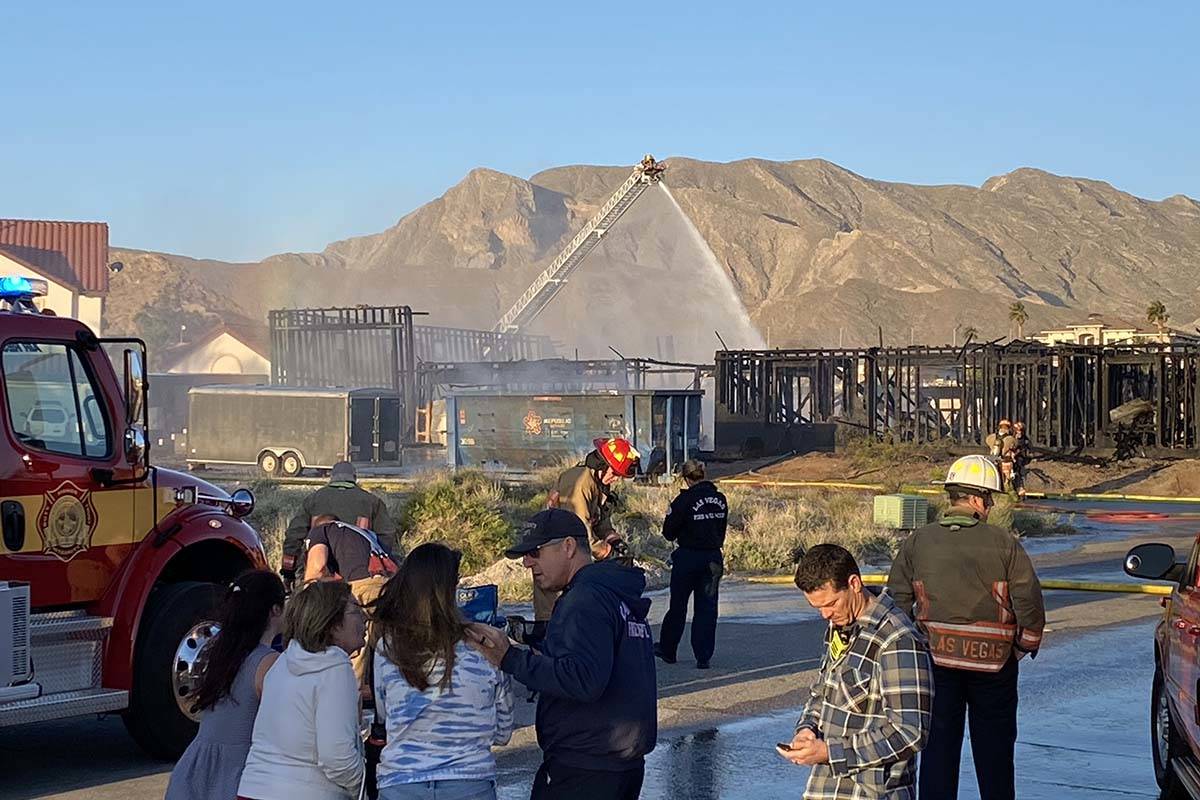 Firefighters battle a two-alarm fire in the 9600 block of West La Madre Way, near West Lone Mou ...