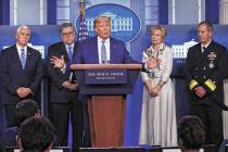 President Donald Trump takes questions from reporters as he speaks about the coronavirus in the ...