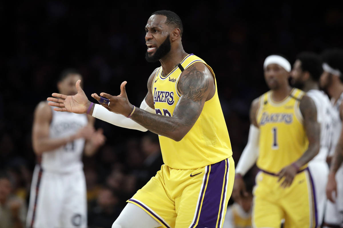Los Angeles Lakers' LeBron James argues a call during the second half of an NBA basketball game ...