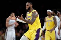 Los Angeles Lakers' LeBron James argues a call during the second half of an NBA basketball game ...