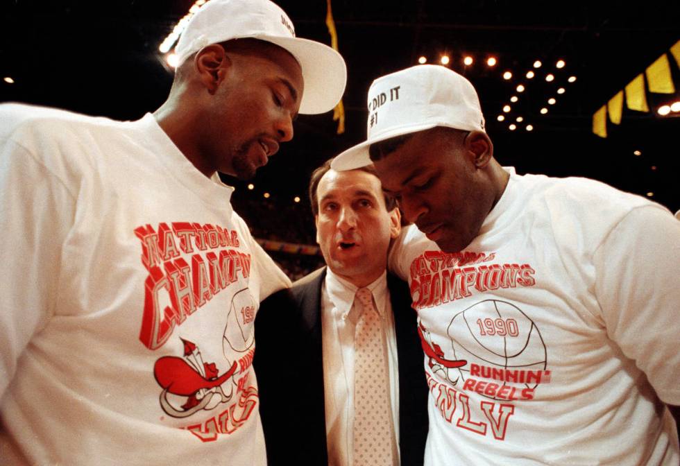 Duke coach Mike Krzyzewsik, center, offers his congratulations to UNLV players Stacey Augmon, l ...