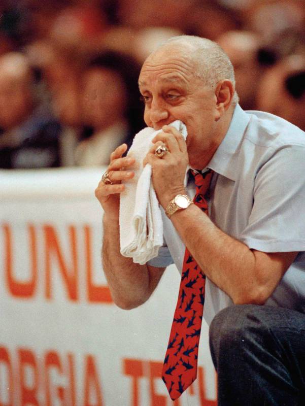 In this April 2, 1990, file photo, UNLV coach Jerry Tarkanian chews on his towel while watching ...