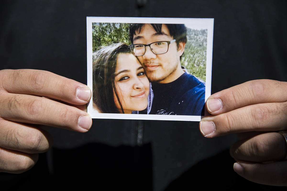 Corey Huh holds a picture of him and his wife Adriana Huh at his pastor's home in Las Vegas, Th ...