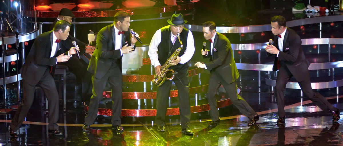 Performing with saxophonist Tommy Alvarado, center, are from left, Phil Burton, Toby Allen, Mik ...