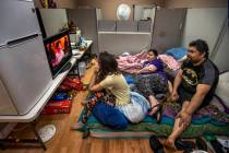 Aubrie Heenan, 17, left, watches Hulu with her parents Stephanie Hedge and Jeremy Ferreira in t ...