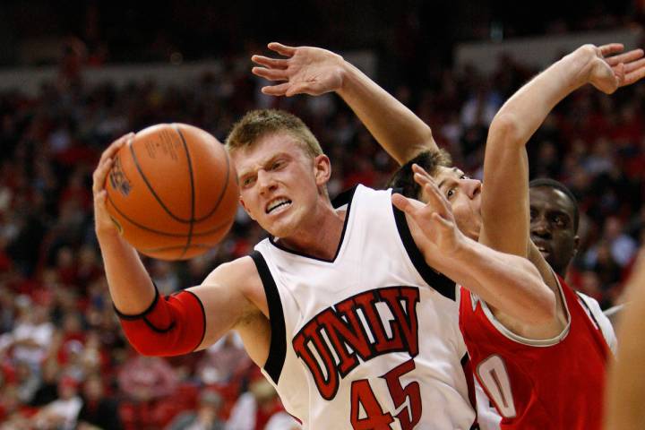 UNLV basketball player Joe Darger grabs a rebound against New Mexico during their game at the T ...