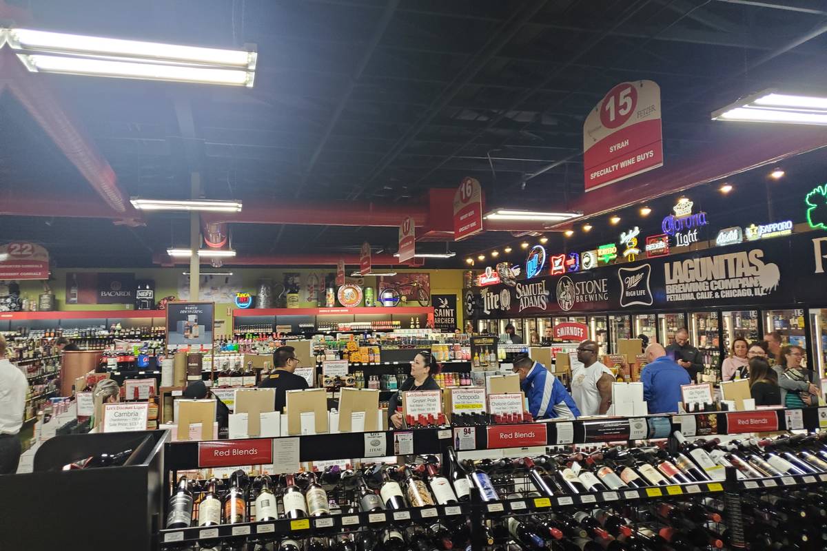 The line to the cashier at a Lee's Discount Liquor in March 2020. (Adam Hill/Las Vegas Review-J ...