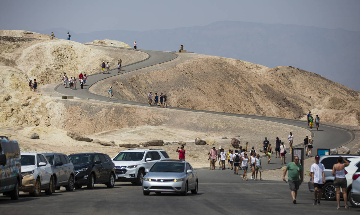 This Aug. 7, 2018, file photo shows visitors at Zabriskie Point in Death Valley National Park, ...