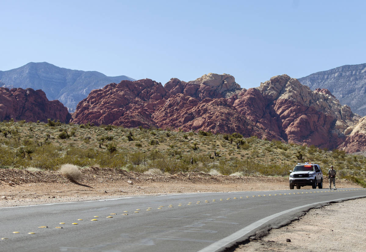 A Metro officer blocks off Calico Basin Road near Red Rock Canyon National Conservation Area on ...