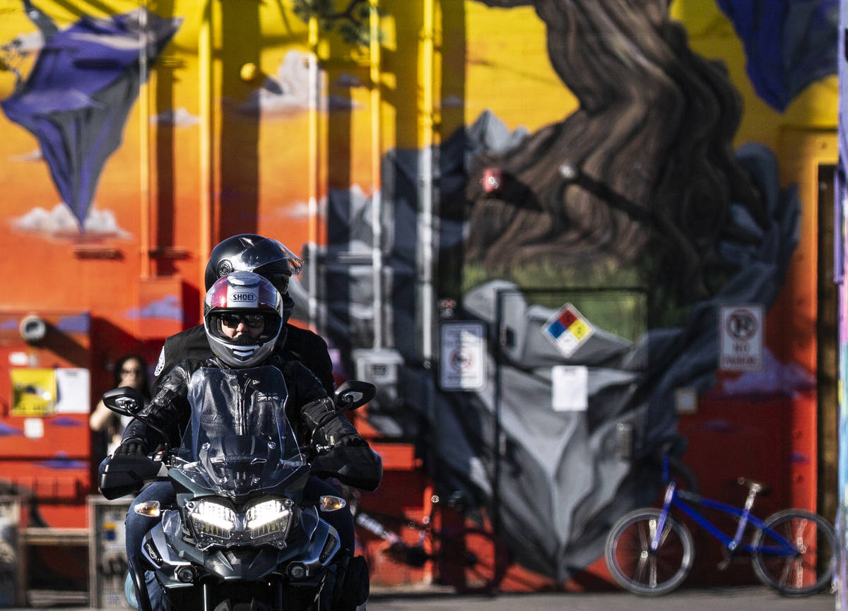 A motorcyclist drives through an alley in the Arts District on Saturday, April 4, 2020, in Las ...