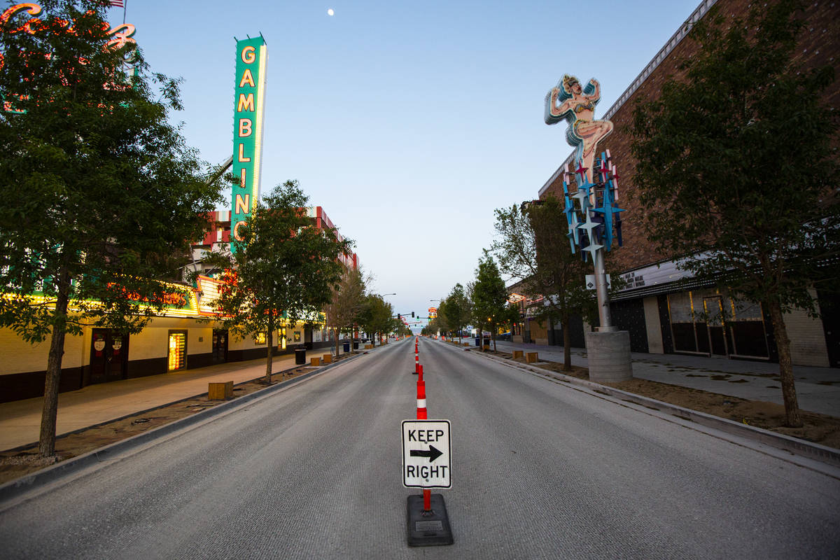A view looking down Fremont East as traffic remains light in the wake of the closure of a stay- ...