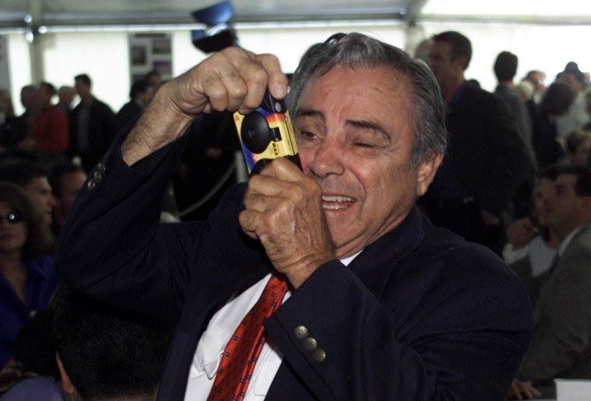 "Uncle" Phil Maloof takes a photo of his nephew George during a press conference announcing the ...