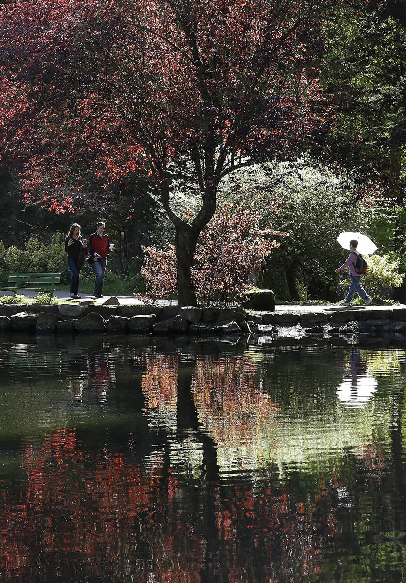 FILE - In this March 10, 2014, file photo, pedestrians walk along a path at Golden Gate Park's ...
