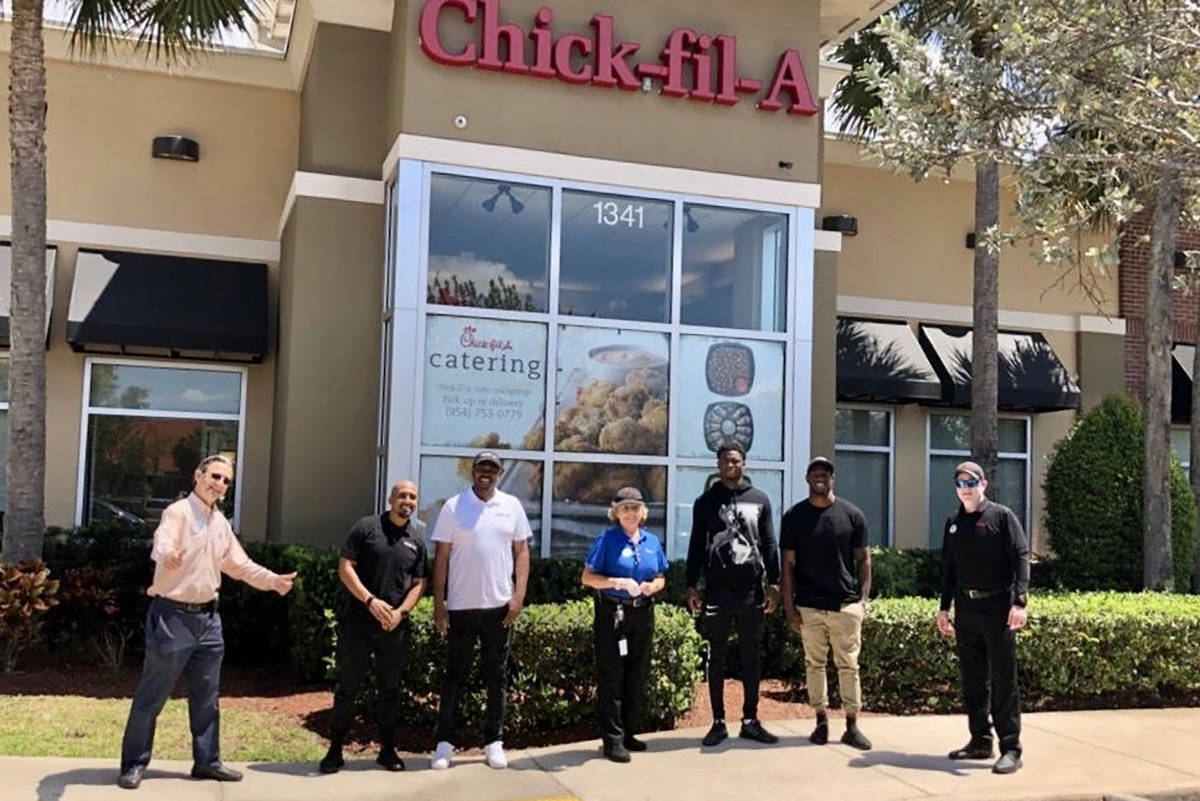 Nevin Lawson and Trayvon Mullen partnered up with Chick-fil-A on Monday to provide more than 25 ...