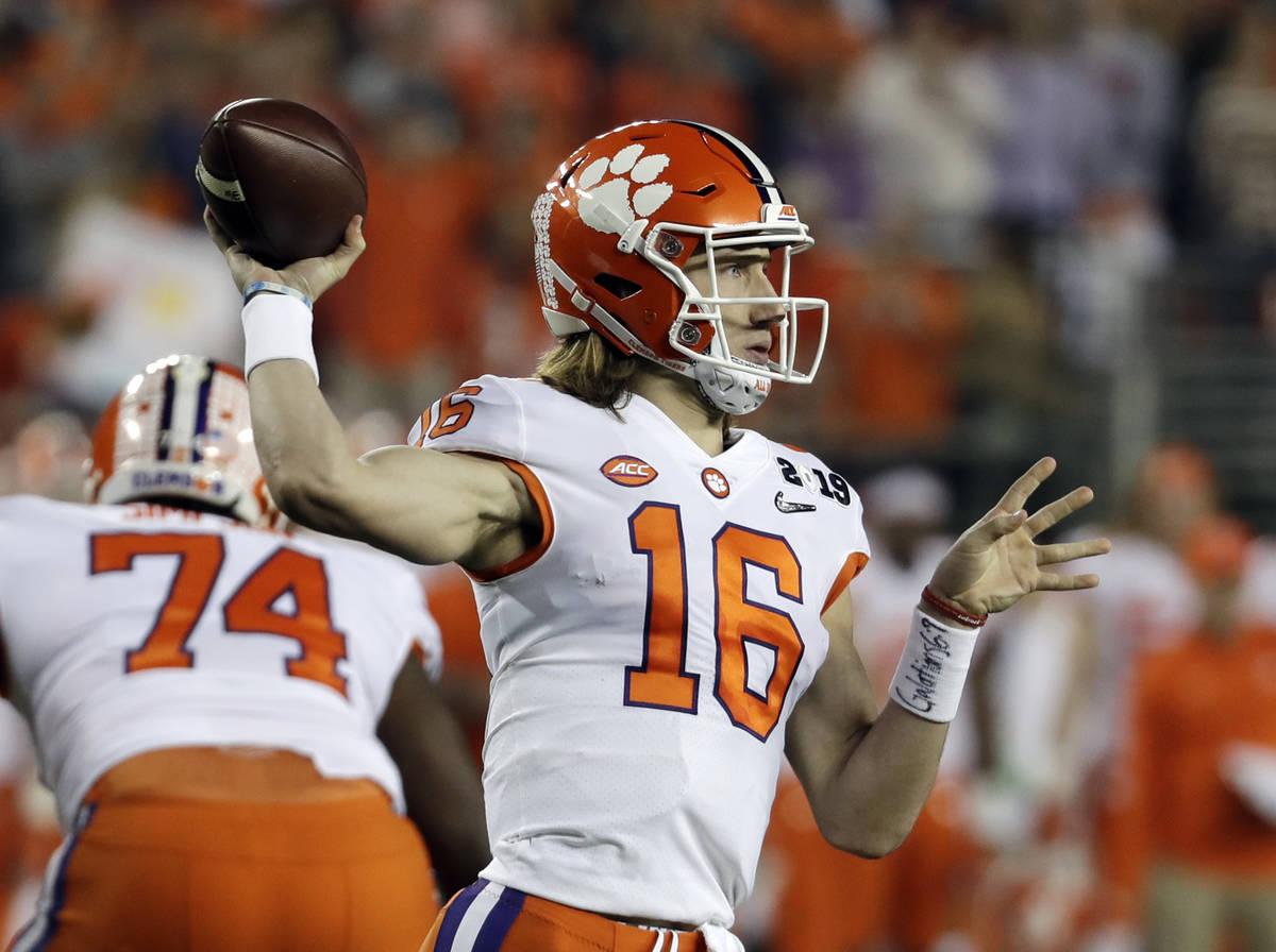 FILE - In this Jan. 7, 2019, file photo, Clemson's Trevor Lawrence throws during the first half ...