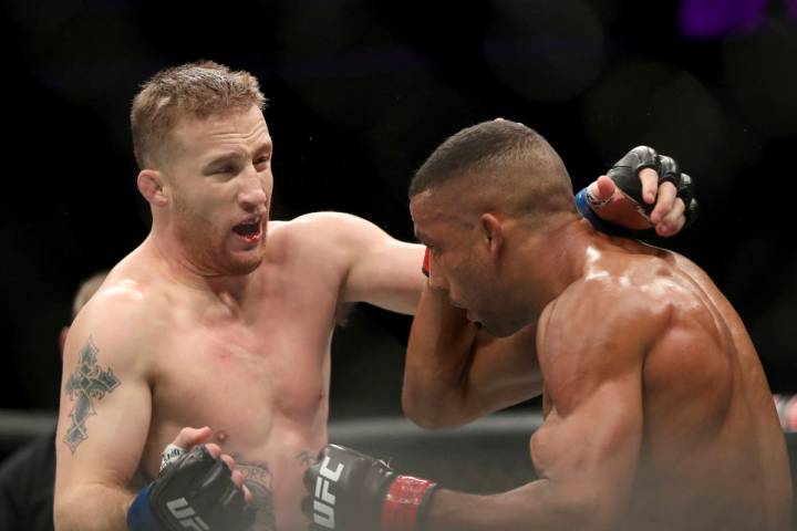 Justin Gaethje, left, exchanges with Edson Barboza during their mixed martial arts bout at UFC ...