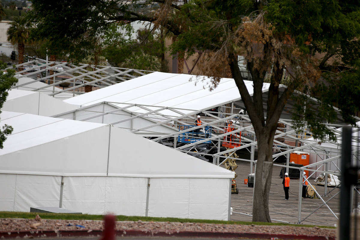 Workers construct the Cashman Isolation-Quarantine Complex at Cashman Center in Las Vegas Monda ...