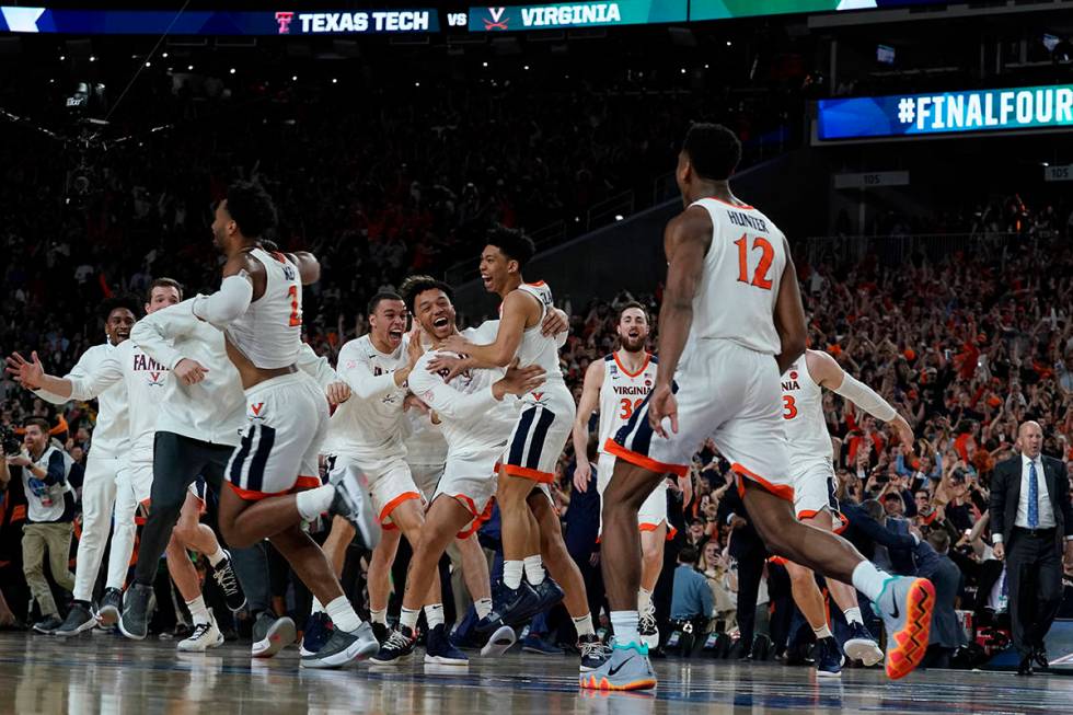File-This April 8, 2019, file photo shows Virginia players celebrating after defeating Texas Te ...