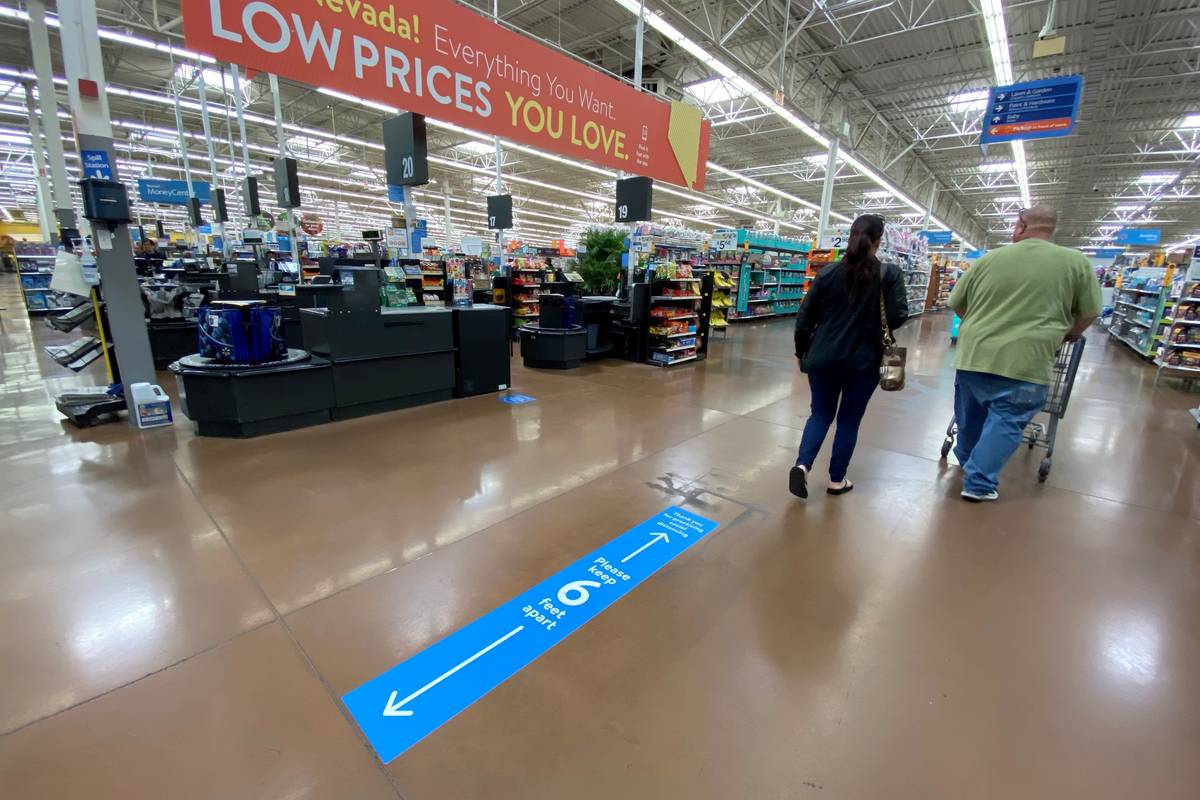 Social distancing markings on the floor at Walmart Supercenter at 3950 W. Lake Mead Blvd. in No ...