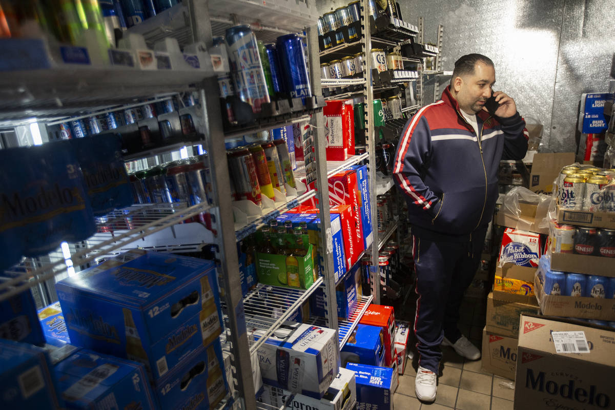 Operations manager Kevork Nersessian talks to a supplier in his depleted cooler at Liquor Empor ...
