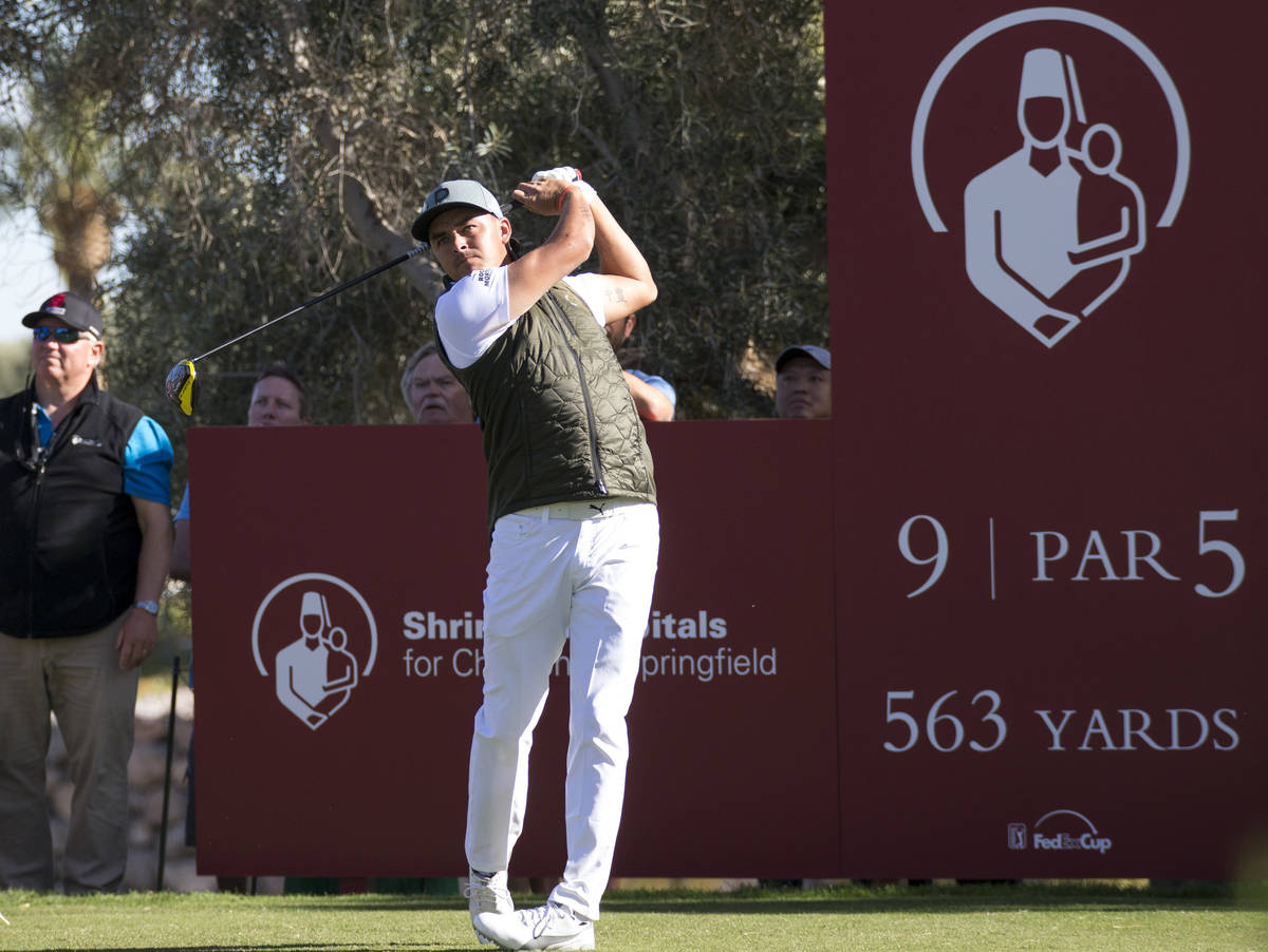 Rickie Fowler watches his drive from the ninth tee during the first round of the Shriners Hospi ...