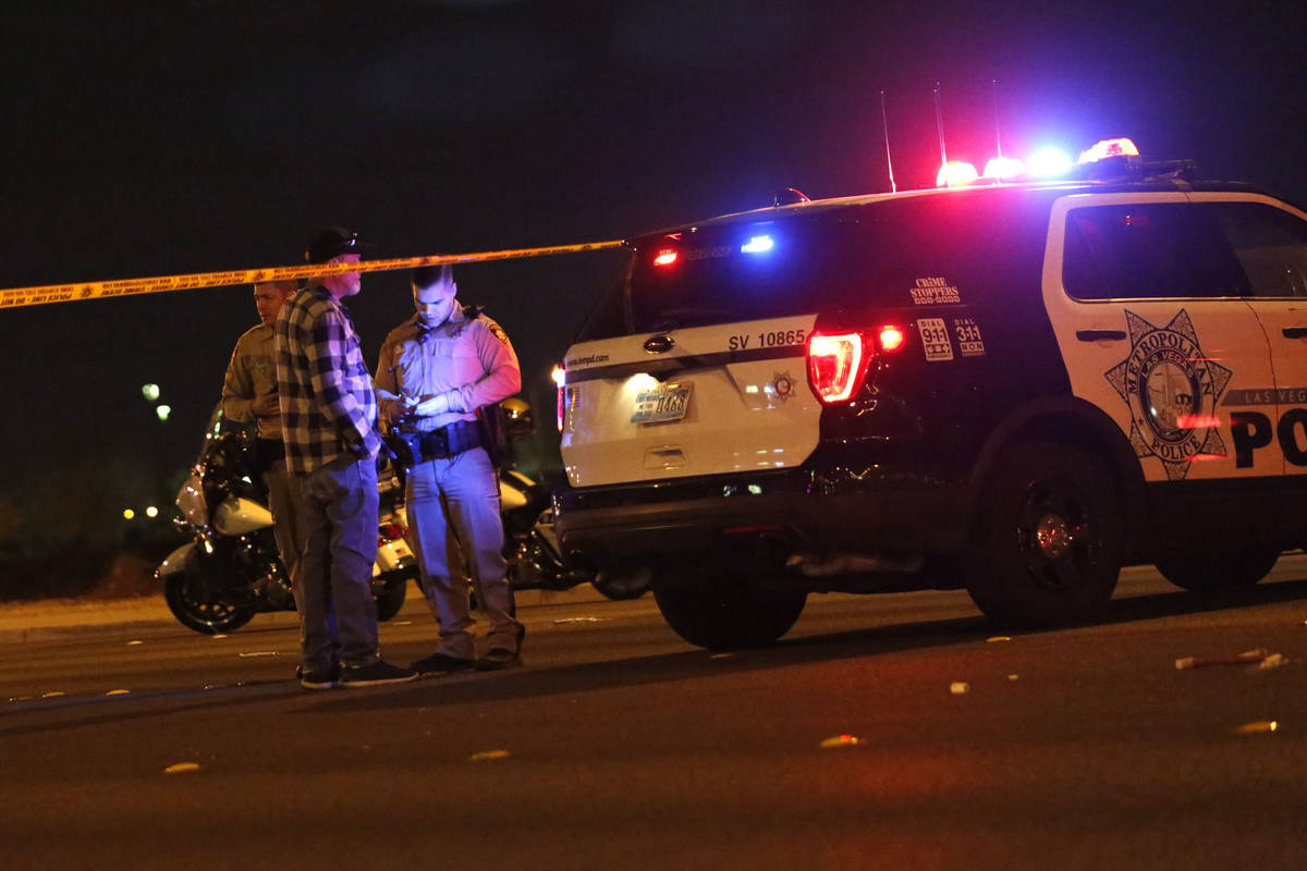 Police work at the scene of a fatal crash near Durango Drive and Twain Avenue in Las Vegas, Sun ...