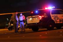 Police work at the scene of a fatal crash near Durango Drive and Twain Avenue in Las Vegas, Sun ...