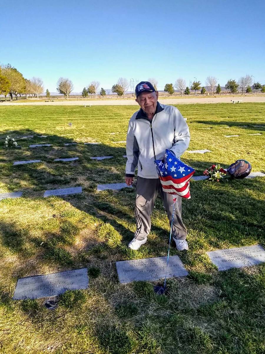 A February 2020 photo of WWII Army veteran Edward Turken, 96, visiting his wife Eva's grave at ...
