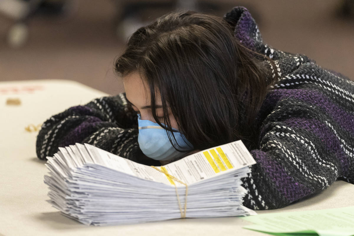 City of Milwaukee Election Commission worker takes a break from processing absentee ballots in ...