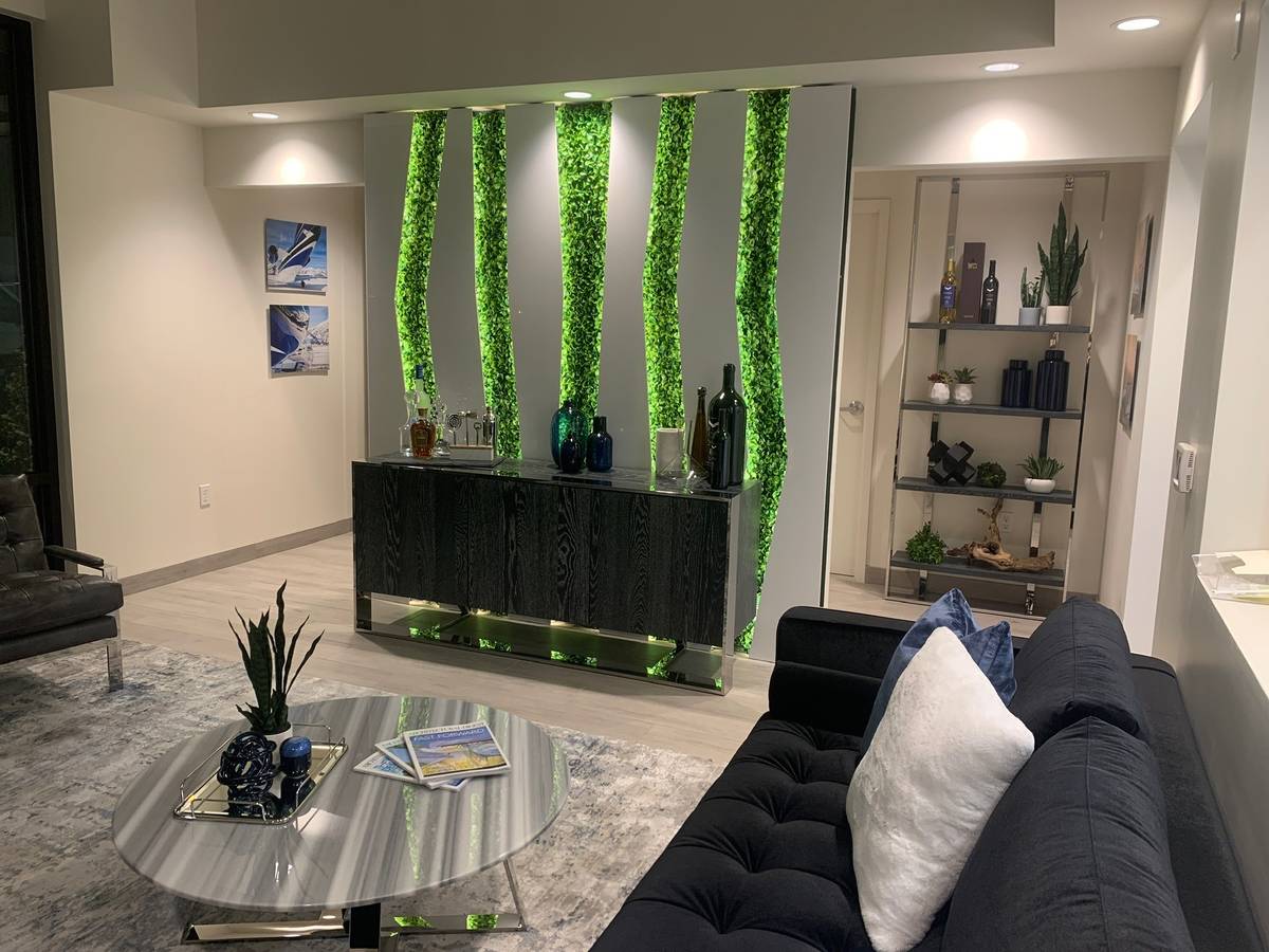 Studio G Architecture designed a wall for Thrive Aviation’s hangar lounge. The setting is per ...