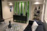 Studio G Architecture designed a wall for Thrive Aviation’s hangar lounge. The setting is per ...
