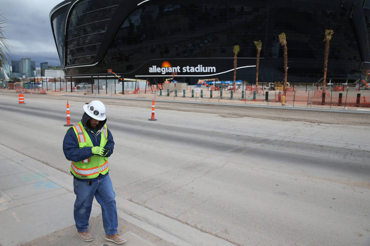 A worker leaves at the end of his shift at the Raiders Allegiant Stadium in Las Vegas, Wednesda ...