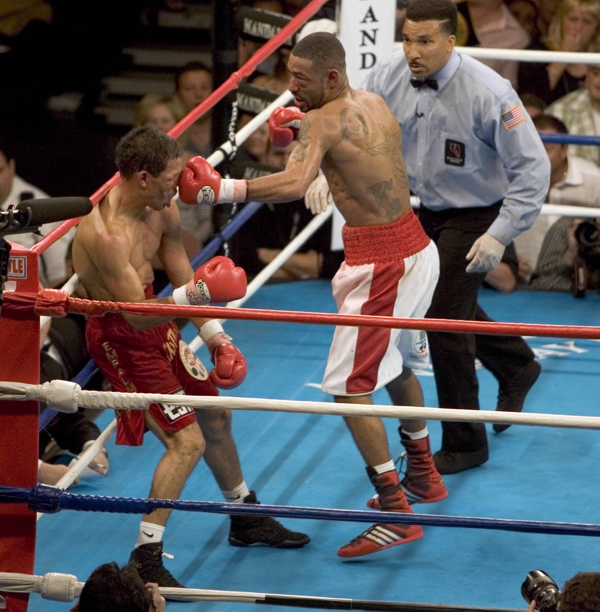 Diego Corrales knocks out Jose Luis Castillo in the 10th round of their WBA/WBO lightweight cha ...