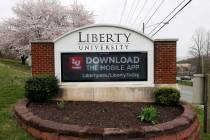 A sign marks the entrance to Liberty University, Tuesday March 24, 2020, in Lynchburg, Va. (AP ...