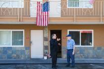 Arnold Stalk, left, talks with a resident at Veterans Village, now known as Share Village, at 1 ...