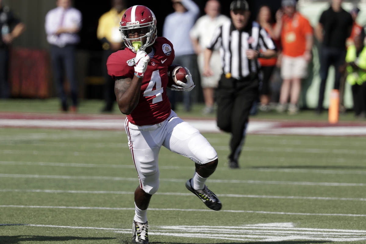 Alabama wide receiver Jerry Jeudy (4) runs after a reception against Michigan during the first ...