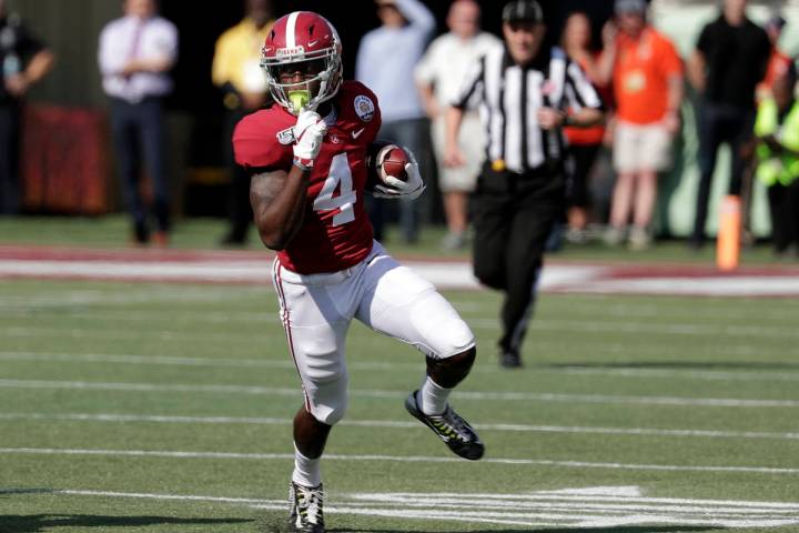 Alabama wide receiver Jerry Jeudy (4) runs after a reception against Michigan during the first ...
