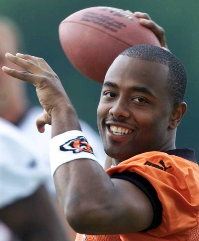 Cincinnati Bengals quarterback Akili Smith warms up during the first day of practice at the tea ...
