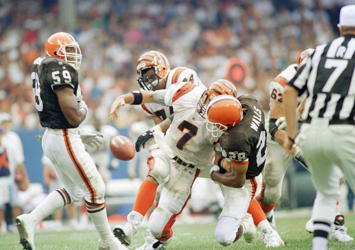 Cincinnati Bengals quarterback David Klingler (7) loses the ball as he is sacked by Cleveland B ...