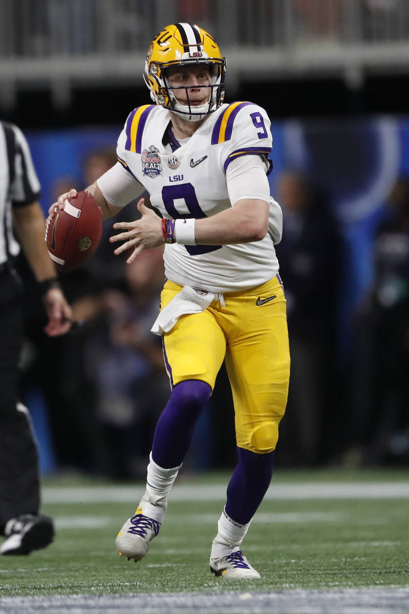 LSU quarterback Joe Burrow (9) works against Oklahoma during the second half of the Peach Bowl ...